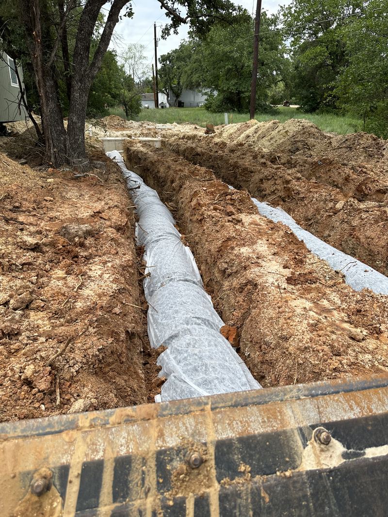 Filter fabric over the aggregate before backfill