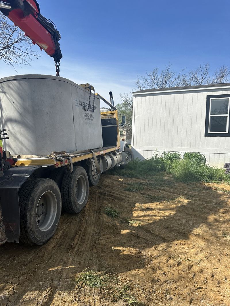 Setting a tank on a tight lot beside an existing home